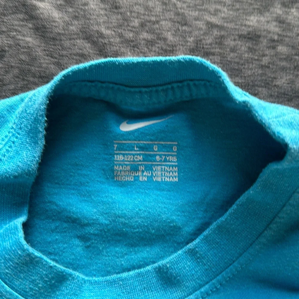 Two (2) Size 6-7YRS Nike dry fit swoosh and Cotton blend just do it tees